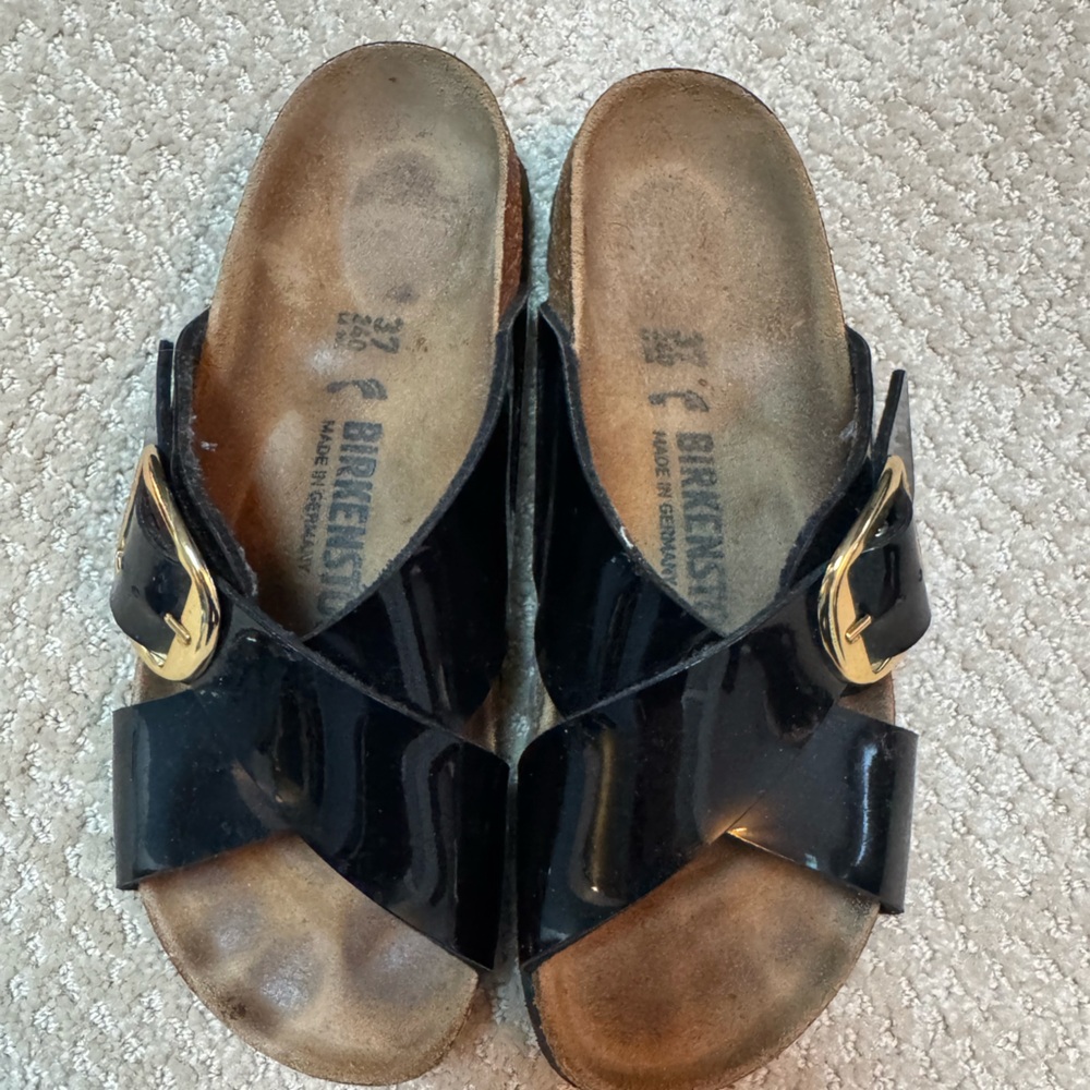 Birkenstock Glossy Black Sandals with Gold Buckle